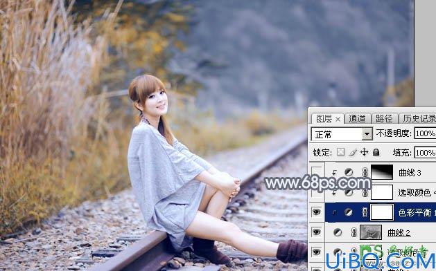 Photoshop调色教程：学习给外景铁路上自拍的美女艺术照调出秋季淡冷色