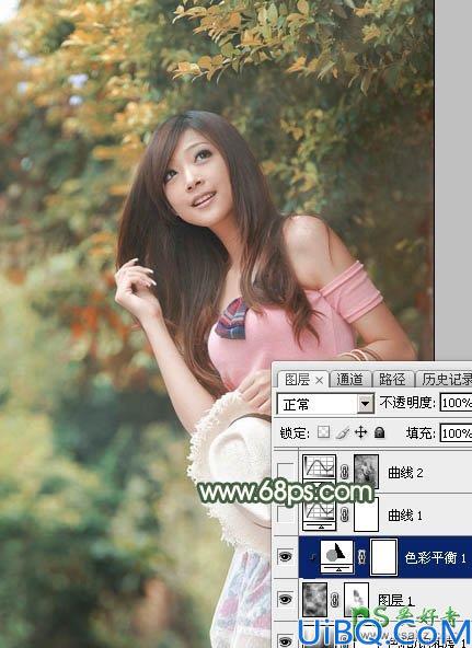 PhotoShop给绿色树林中自拍的女生照片调出唯美的秋季红褐色