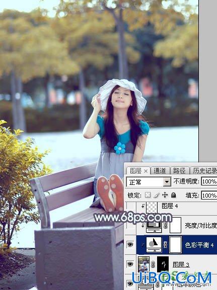 PS给公园里自拍的漂亮女生唯美的图片调出秋季蓝黄色