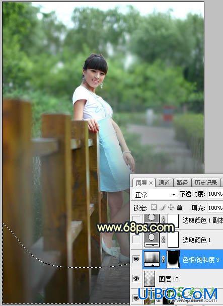 PS给景区木桥上拍摄的中年女人写真图片调出唯美的曦色