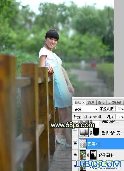 PS给景区木桥上拍摄的中年女人写真图片调出唯美的曦色